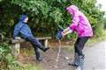 In Pictures: Umbrellas at the ready as dry weather gives way to downpours