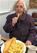 100-year-old Betty tucking in to some fish and chips.