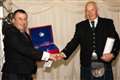 Retired coastguard honoured for saving lives