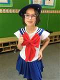 P4 pupil Enya McCarthy dressed in the colours of the French flag.