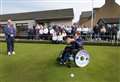 Liam opens St Fergus season using specially designed bowling wheelchair