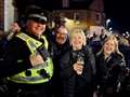 Party-goers pose for a photo with a friendly policeman. Picture: John Wright Studio
