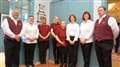 The staff stand resplendent in their new uniforms. The Castle of Mey Trust prides itself on employing local folk.