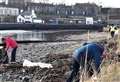 PICTURES: Selfless volunteers beaver away to clear storm debris on Wick shore 