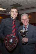 Ben Sinclair, player of the year and supporters' player of the year, receives his trophies from club stalwart Jocky Shearer.