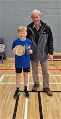 Under-11 boys' singles winner Liam Sinclair with tournament sponsor Ronald Mackay.