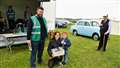 Heather Norburn won a raffle prize. She is pictured with her son Toby and on the left James Green who is vice chair of the club and Willie Mackay who compered the event. Picture: DGS