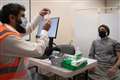 Pharmacist urges people to get jab after vaccinating father at Islamic centre