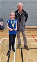 U11 girls' consolation winner April Steven with tournament sponsor Ronald Mackay.