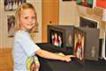 This little girl was delighted to find a photo of her mum as gala queen. Picture: Eswyl Fell