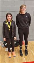 U13 girls' singles consolation winner Blayr Howden with Chloe Mackenzie from Highland Workwear.