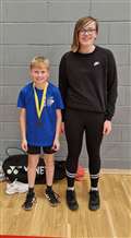 U13 boys' singles consolation Winner Liam Sinclair with Chloe Mackenzie from Highland Workwear.