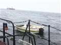 Abandoned boat sinks under tow to Wick