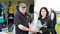 Seventeen-year-old Sophie Mackillop from Wick received the Lee Meiklejohn Memorial Trophy for Best Junior Car Enthusiast from club chair Kevin Sutherland. Picture: DGS