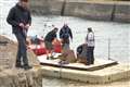 Some of the crew members working on a specially built pontoon in Keiss harbour for use in The Crown episode about the assassination of Lord Mountbatten. Pictures: DGS