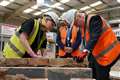 Johnson tries hand at bricklaying on visit intended to help cement his future