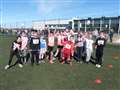 Junior triathletes in high spirits at the Wick all-weather pitch.
