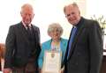 Prince presents church certificate to long-serving Sheila