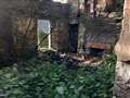 Charred wood inside the derelict cottage showing where the fire was. Picture supplied