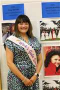 Lorraine Bremner stands beside a picture of herself as the town's Gala Queen in 1991. Picture: Eswyl Fell