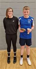 Under-13 boys' singles winner Dhaill Mackay with Chloe Mackenzie from sponsor Highland Workwear.