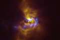 Large dusty clumps around young star provide insight into how planets are born