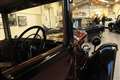 A view through the window of one the vintage cars.