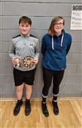 Boys' singles winner Lewis Malcolm with Chloe Mackenzie of Highland Workwear.
