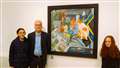 Artist Willie Wallace with his daughters and his work called Caithness Winter Warmers. The painting includes a copy of the Caithness Courier within it along with other local icons. Picture: DGS