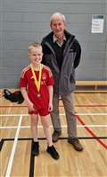 U11 boys' consolation winner Joshua Mackenzie with tournament sponsor Ronald Mackay.