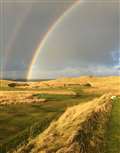 A recent view of the sixth hole at Reay golf course with a rainbow over the green.