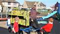 James gets a helping hand from some local Castletown Primary School children.