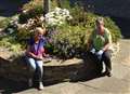 Volunteers Yvonne Hendry (left) and Catherine Miller working in the memorial garden earlier this month.