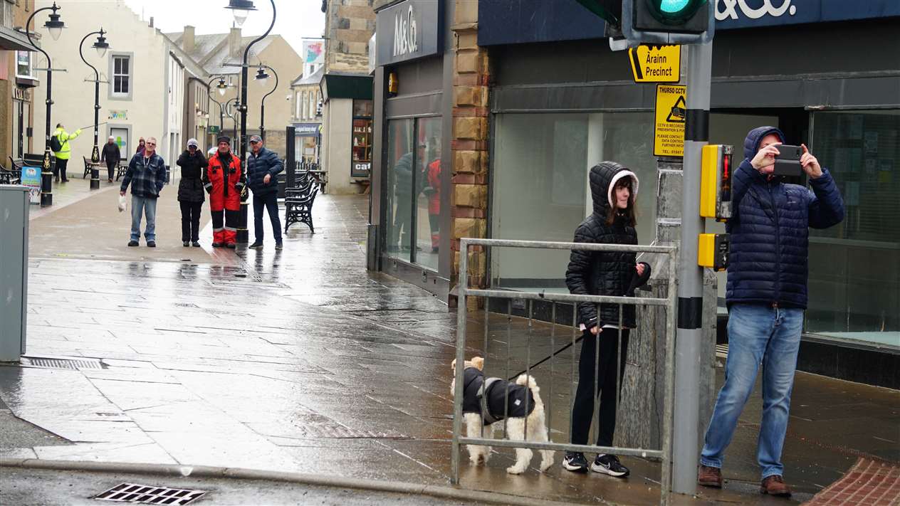A bystander takes a picture at the scene of the incident today. Picture: DGS
