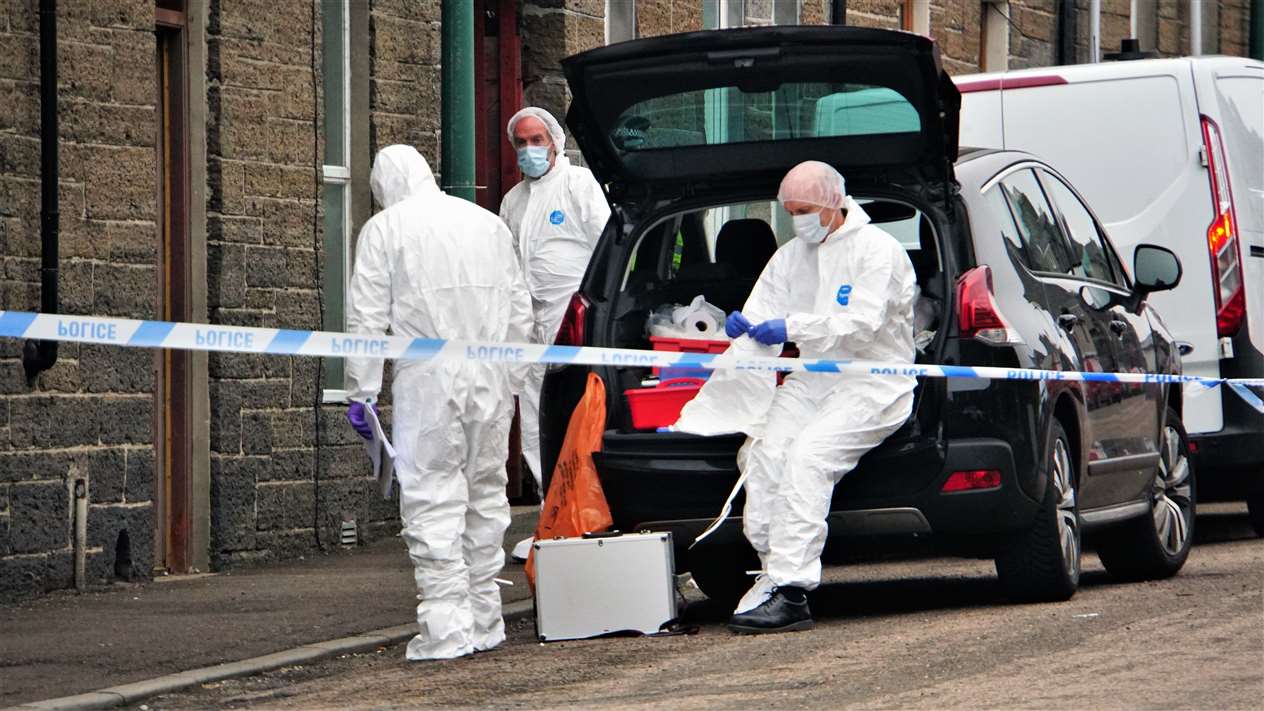 Police attending the scene at Wick's Barrogill Street on Sunday. Picture: DGS