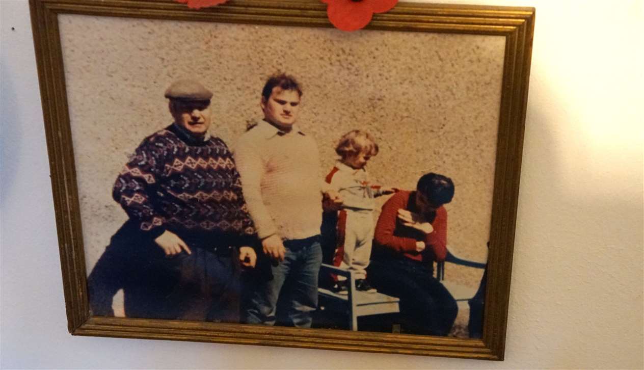 Charlie McPhee's family pictures on the wall of his house. Picture: DGS