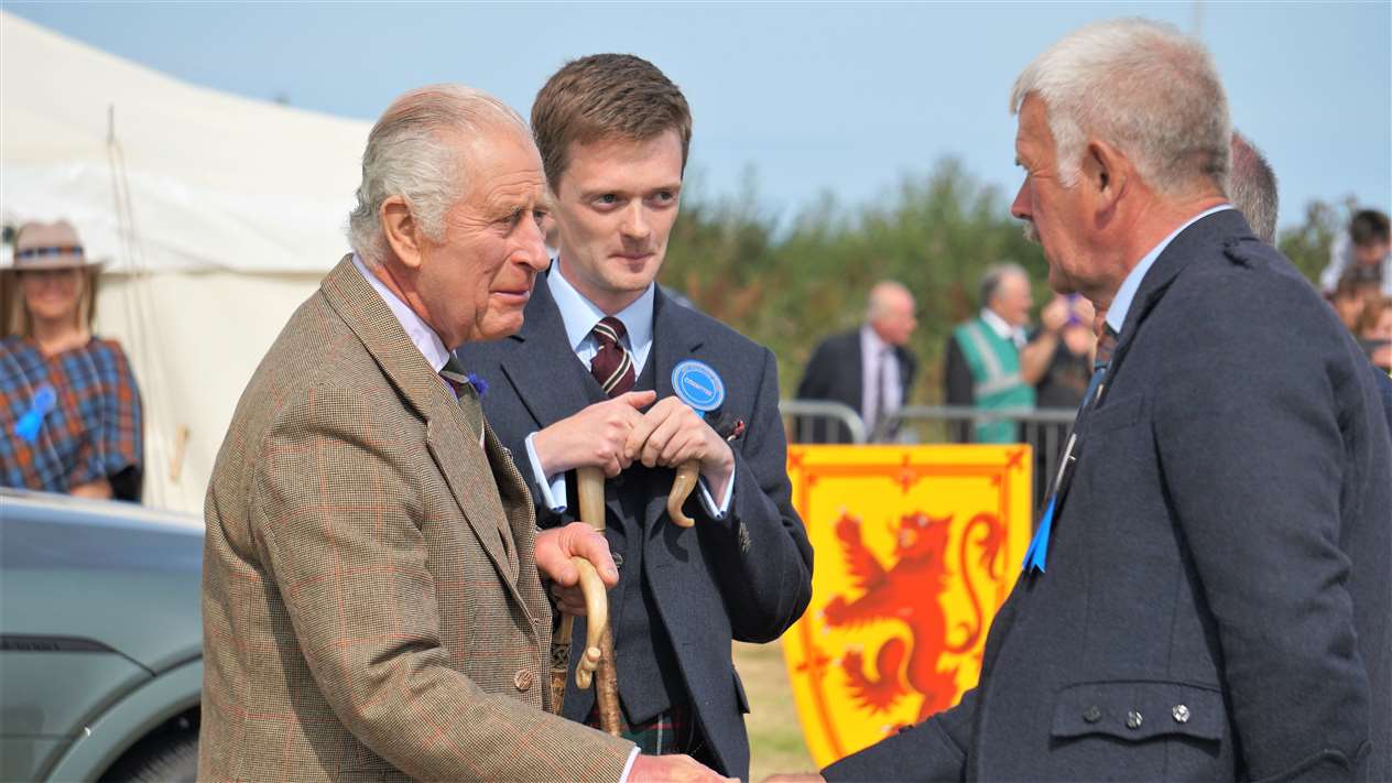 Shaking the King's hand is Charlie Murray, president of the Scottish Highland Games Association, who was running events on the field. Picture: DGS