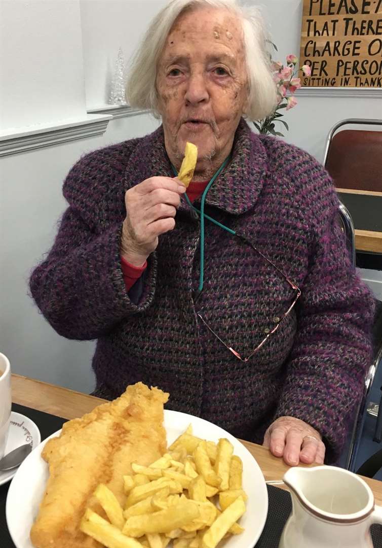 100-year-old Betty tucking in to some fish and chips.