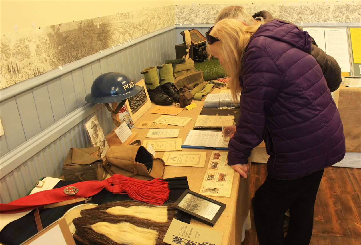 Guests studying some of the war artefacts.