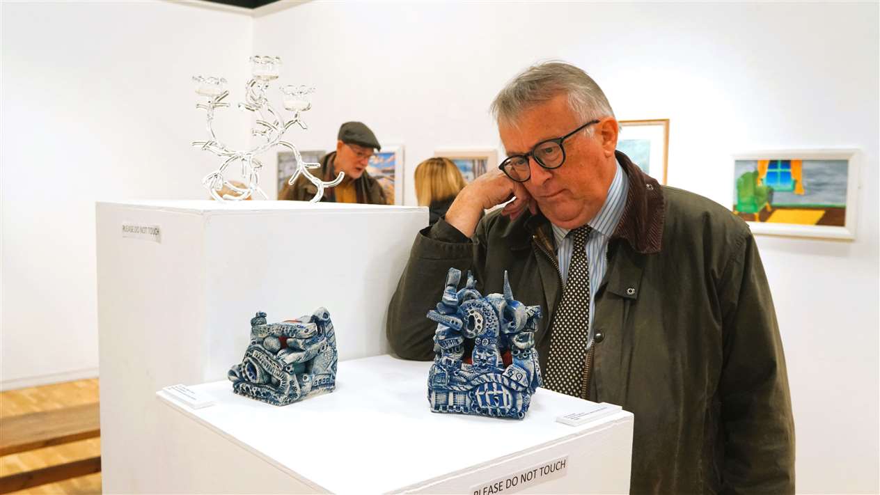 Jamie Stone, the MP Caithness, Sutherland and Easter Ross, paid a visit to the show and gazes at David Kinghorn's sculptural works. Picture: DGS