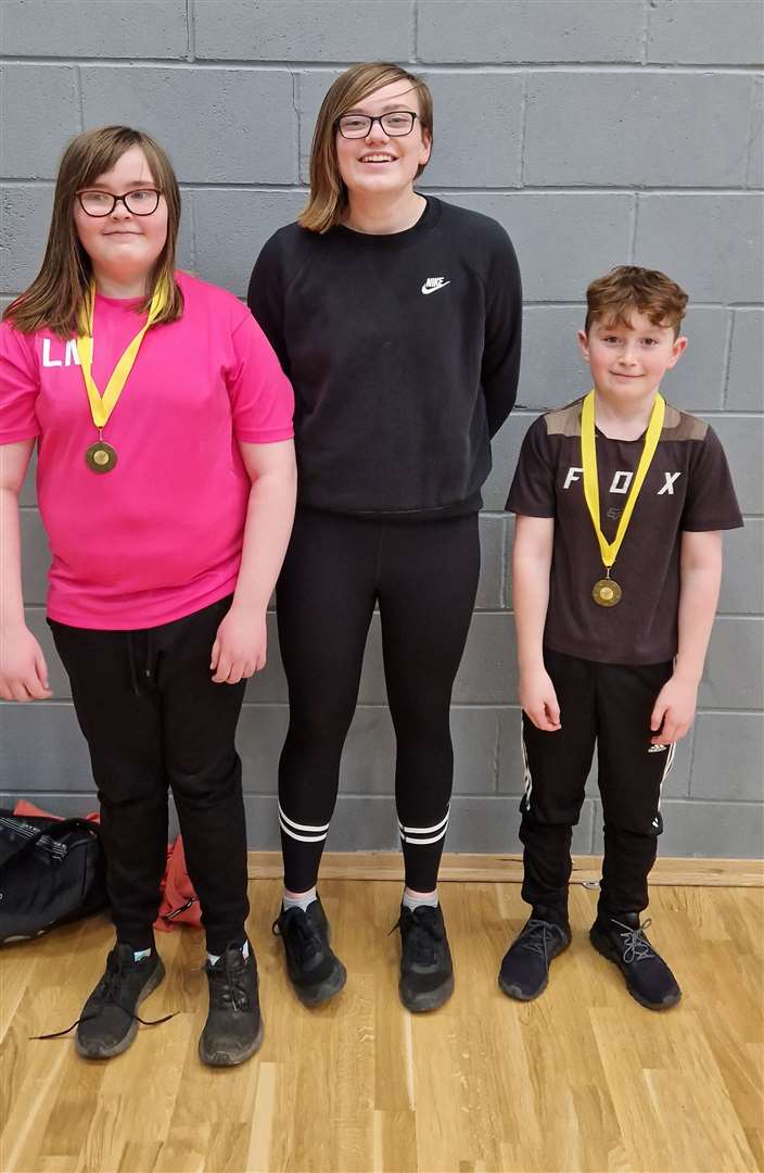 U13 mixed consolation winners Lexie Mackenzie and Alex Richard with Chloe Mackenzie.