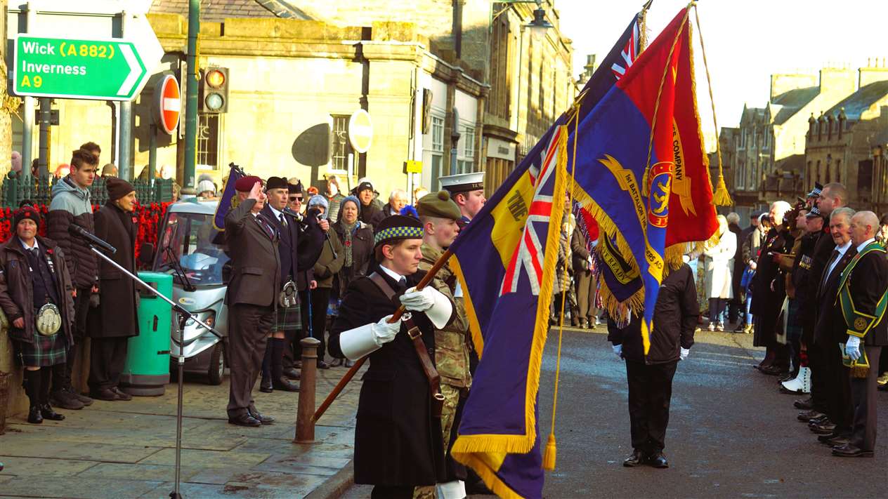 Colours are lowered as a tribute to the fallen on Remembrance Sunday in Thurso. Picture: DGS