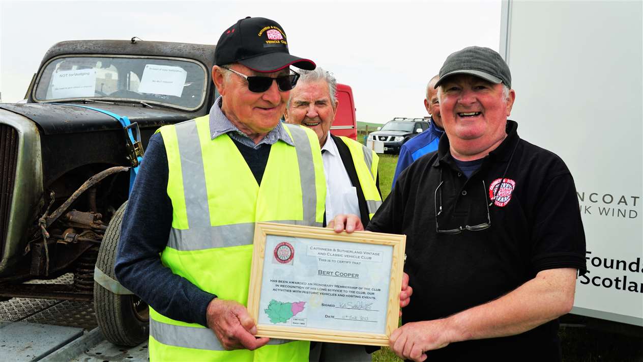 Bert Cooper, left, was given honorary membership of Caithness and Sutherland Vintage and Classic Vehicle Club by chair Kevin Sutherland. Picture: DGS