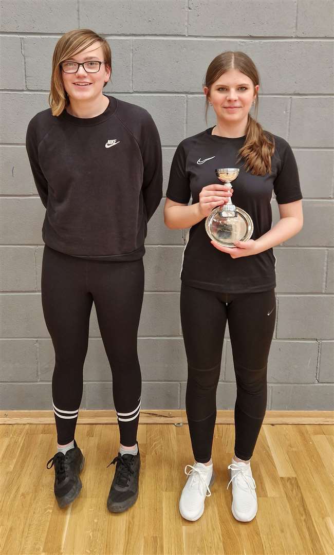Under-13 girls' singles winner Ashlyn Gunn with Chloe Mackenzie of Highland Workwear.