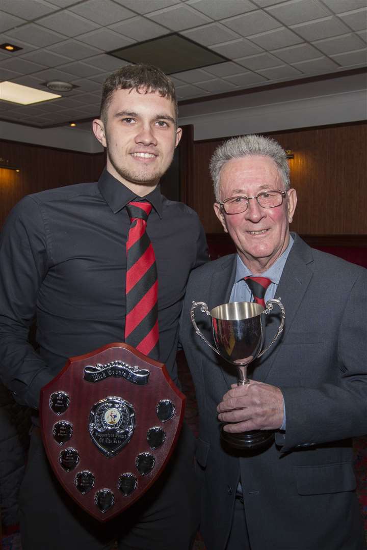 Ben Sinclair, player of the year and supporters' player of the year, receives his trophies from club stalwart Jocky Shearer.