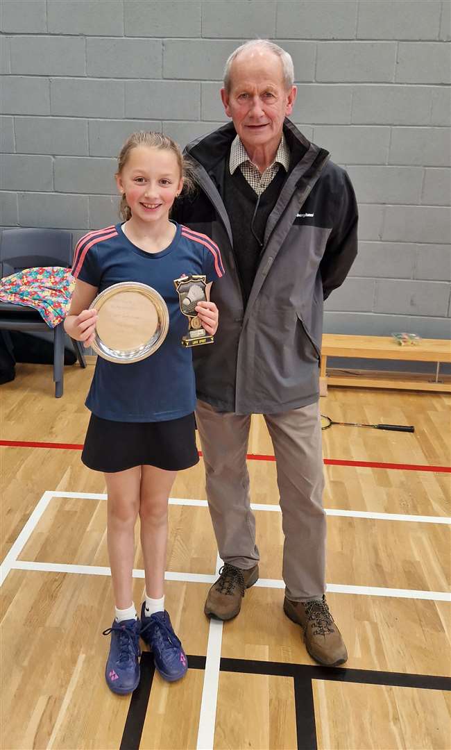 Under-11 girls' singles winner Sophie Mackay with tournament sponsor Ronald Mackay.