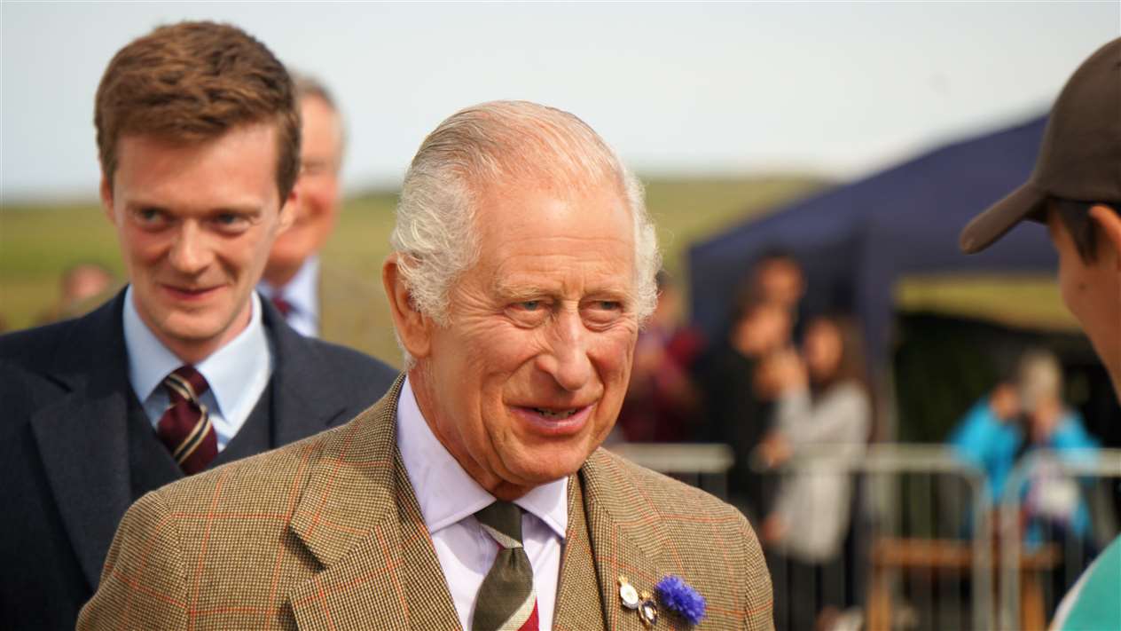 King Charles III congratulates members of the Caithness Rugby Club which won the tug of war at the Mey Highland Games 2023. Picture: DGS