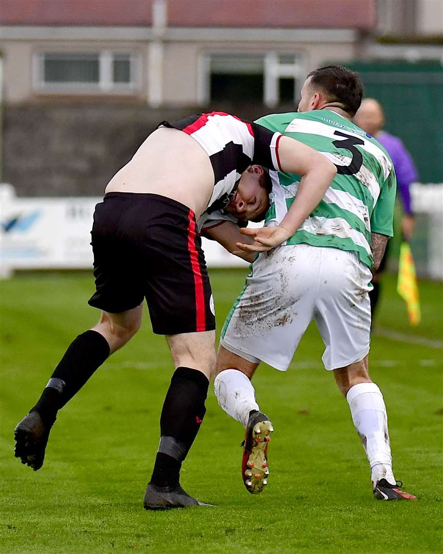 Buckie's Darryl McHardy tries to take possession of Owen Rendall's shirt. Picture: Mel Roger