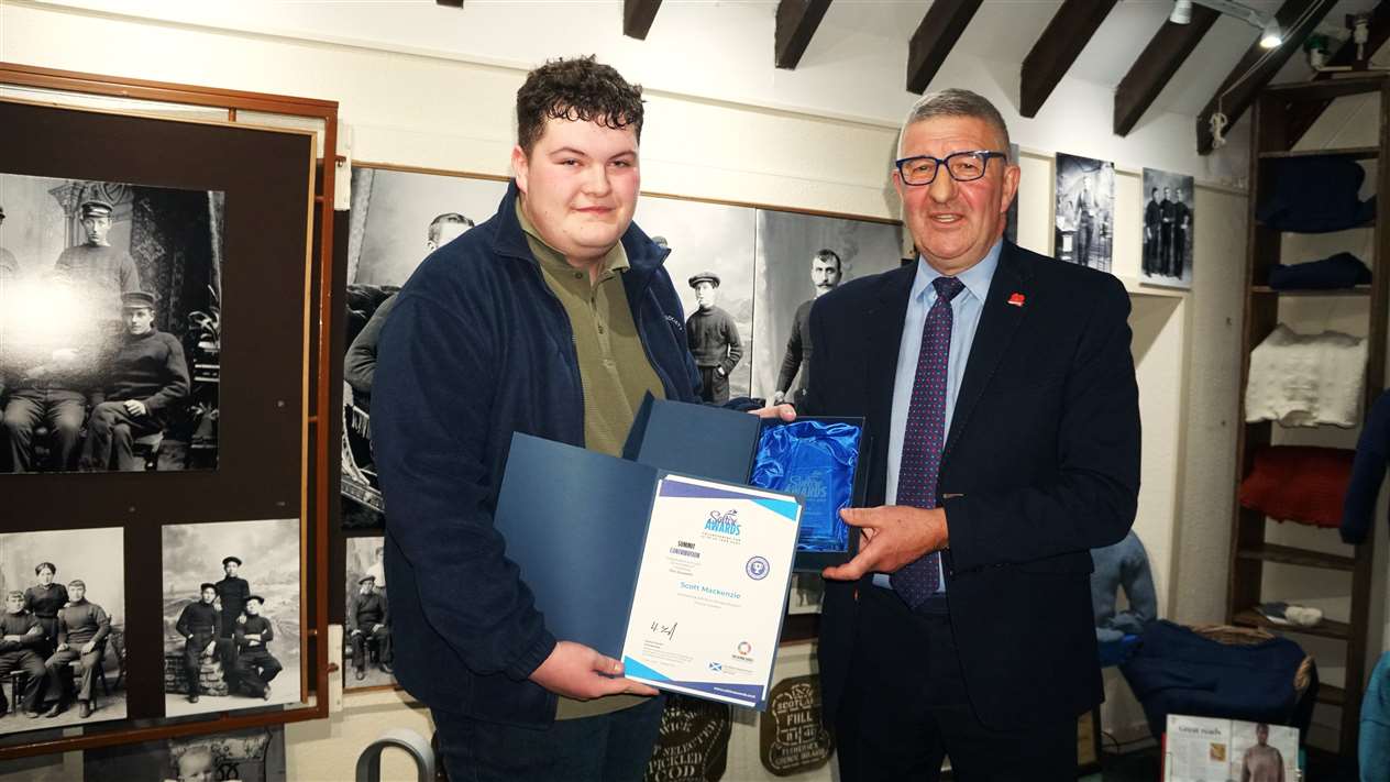 Scott Mackenzie receives his Saltire Summit Award from Willie Watt. Picture: DGS