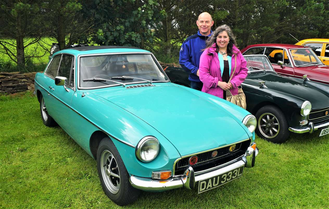 Kirsty and Jason Gell from Barrock with their MGB GT which they've had since 1998. They also have several other classic cars and said they were delighted to find a local vintage car club when they moved to Caithness three years ago. Picture: DGS
